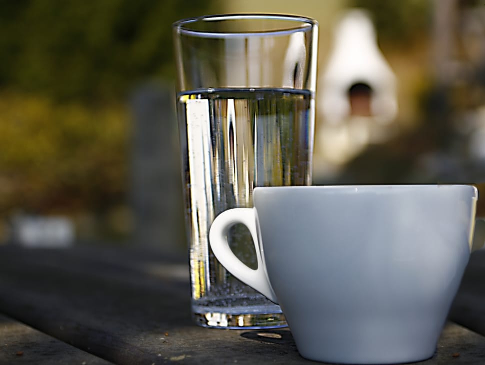 white ceramic teacup and clear drinking glass preview