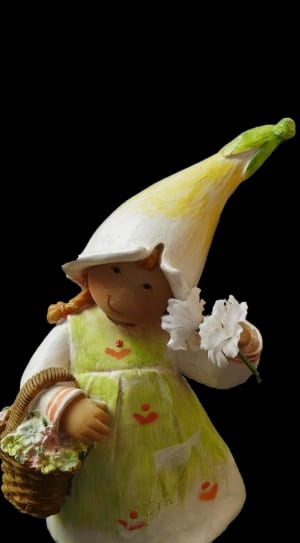 brown haired girl wearing yellow white and green hat figurine thumbnail