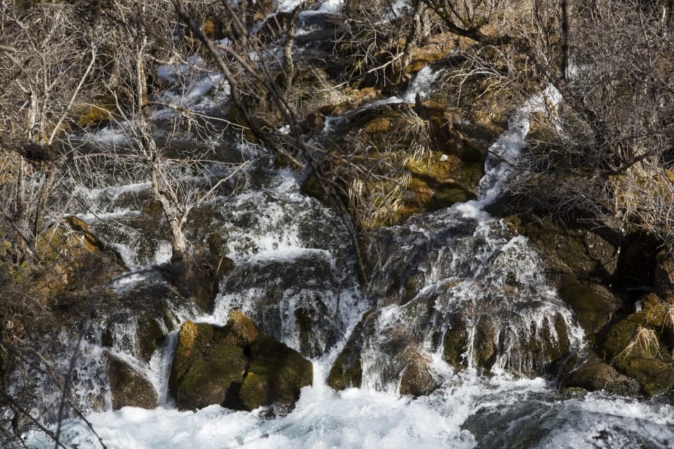 shallow focus photography of running water on mountain during daytime preview
