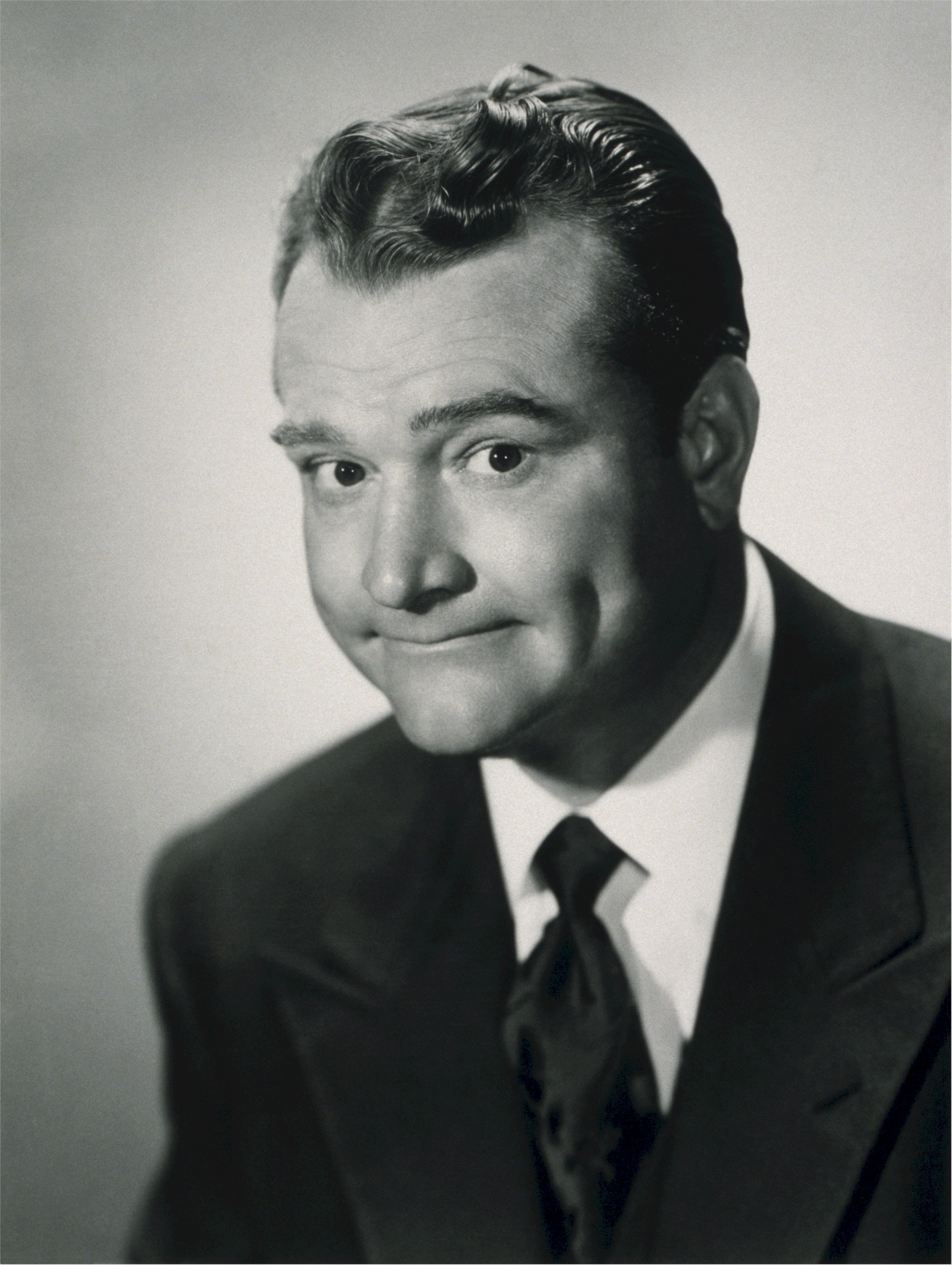 grayscale photo of person in black suit jacket
