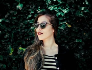 women wearing black frame  sunglasses  in day time thumbnail