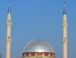 red and gray dome mosque with 2 towers thumbnail