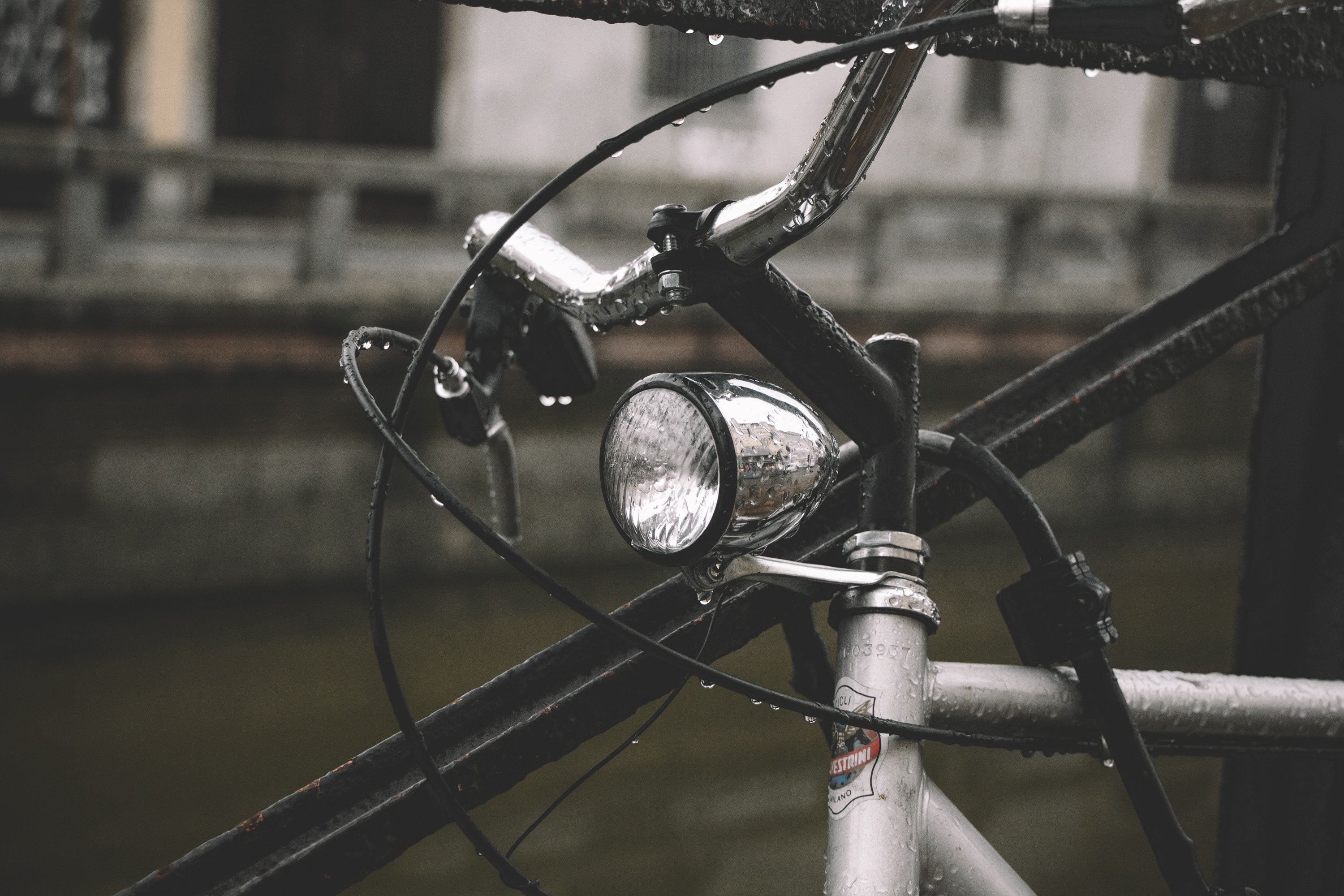 silver round light under bicycle handle bar