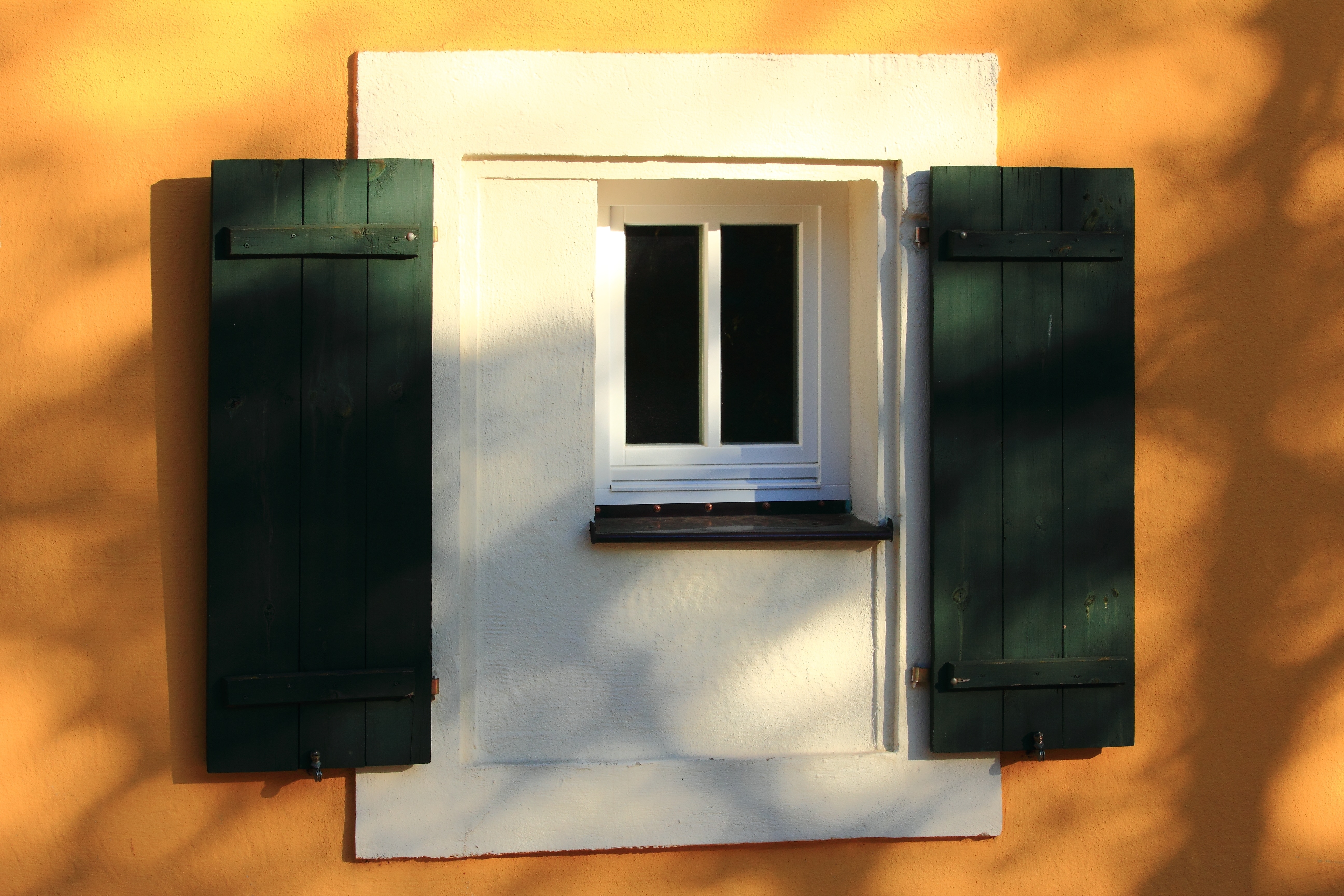 white and green wooden window