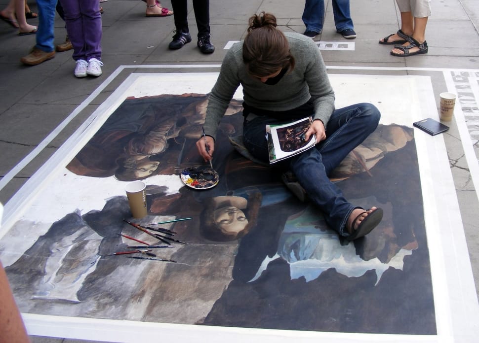 man wearing gray long sleeve shirt painting on floor preview