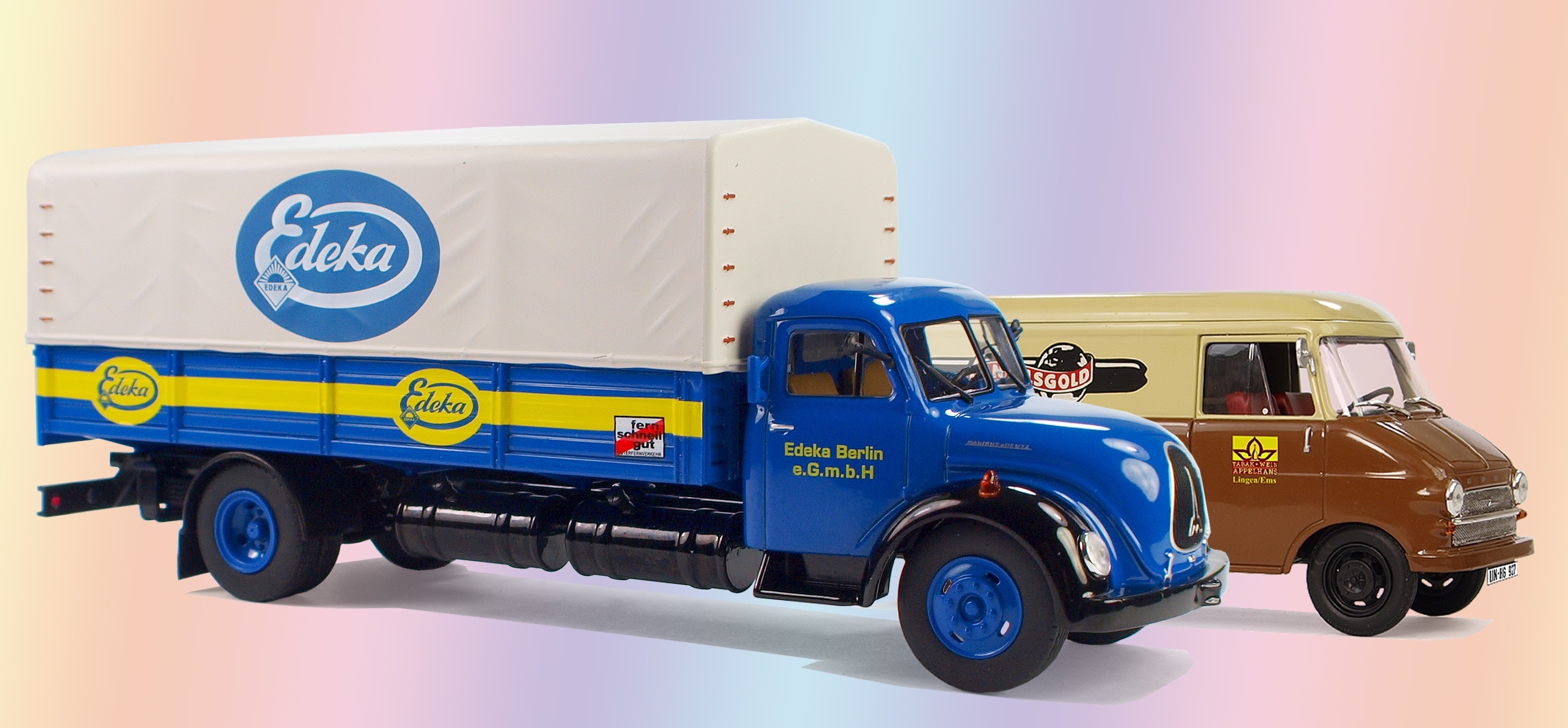 blue freight truck and utility van die-cast scale model