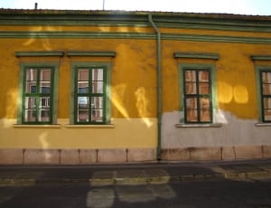 wall painted with yellow and white during daytime thumbnail