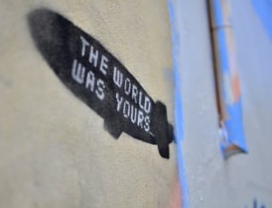 the world was yours print on brown surface thumbnail