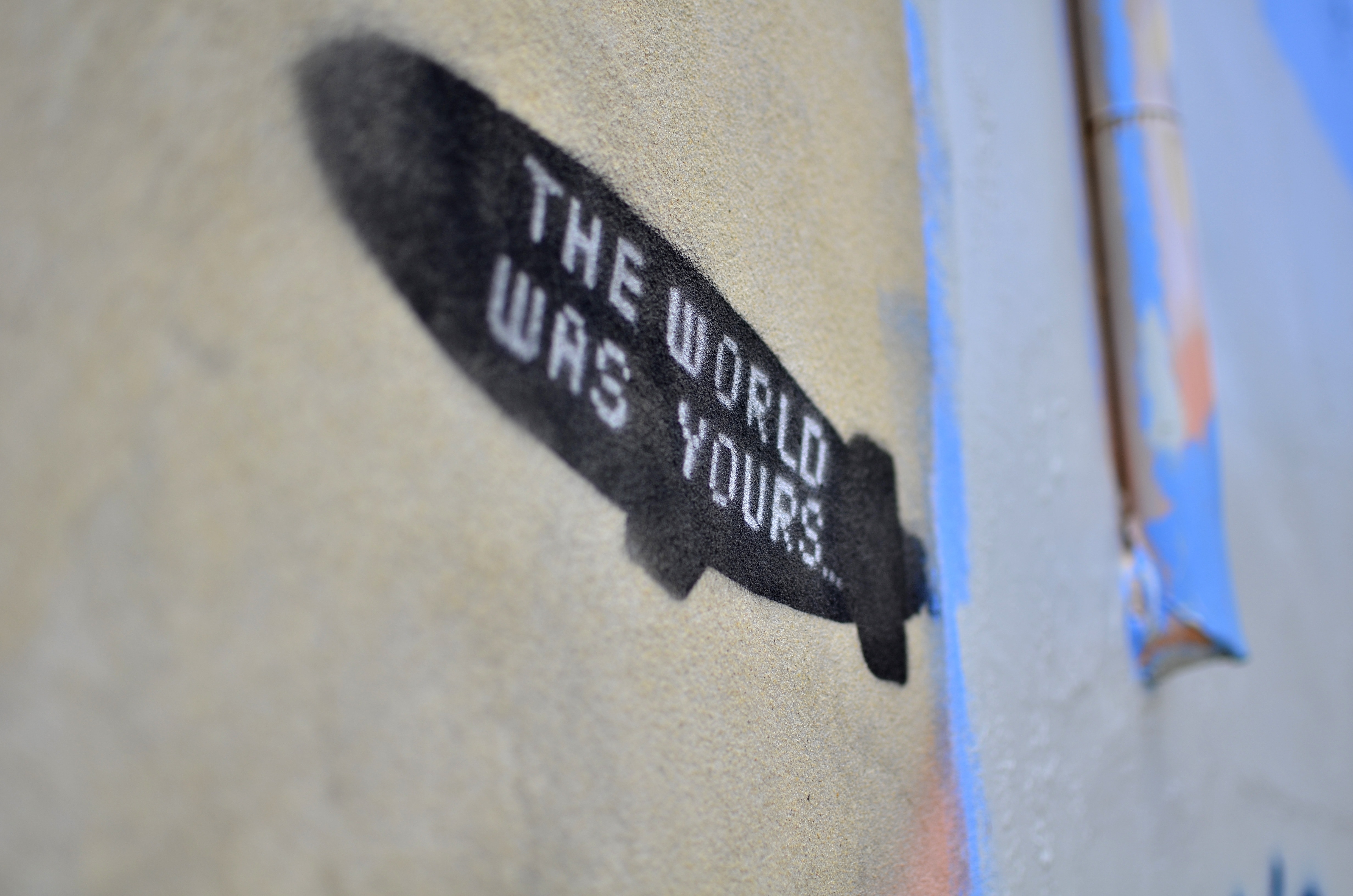 the world was yours print on brown surface