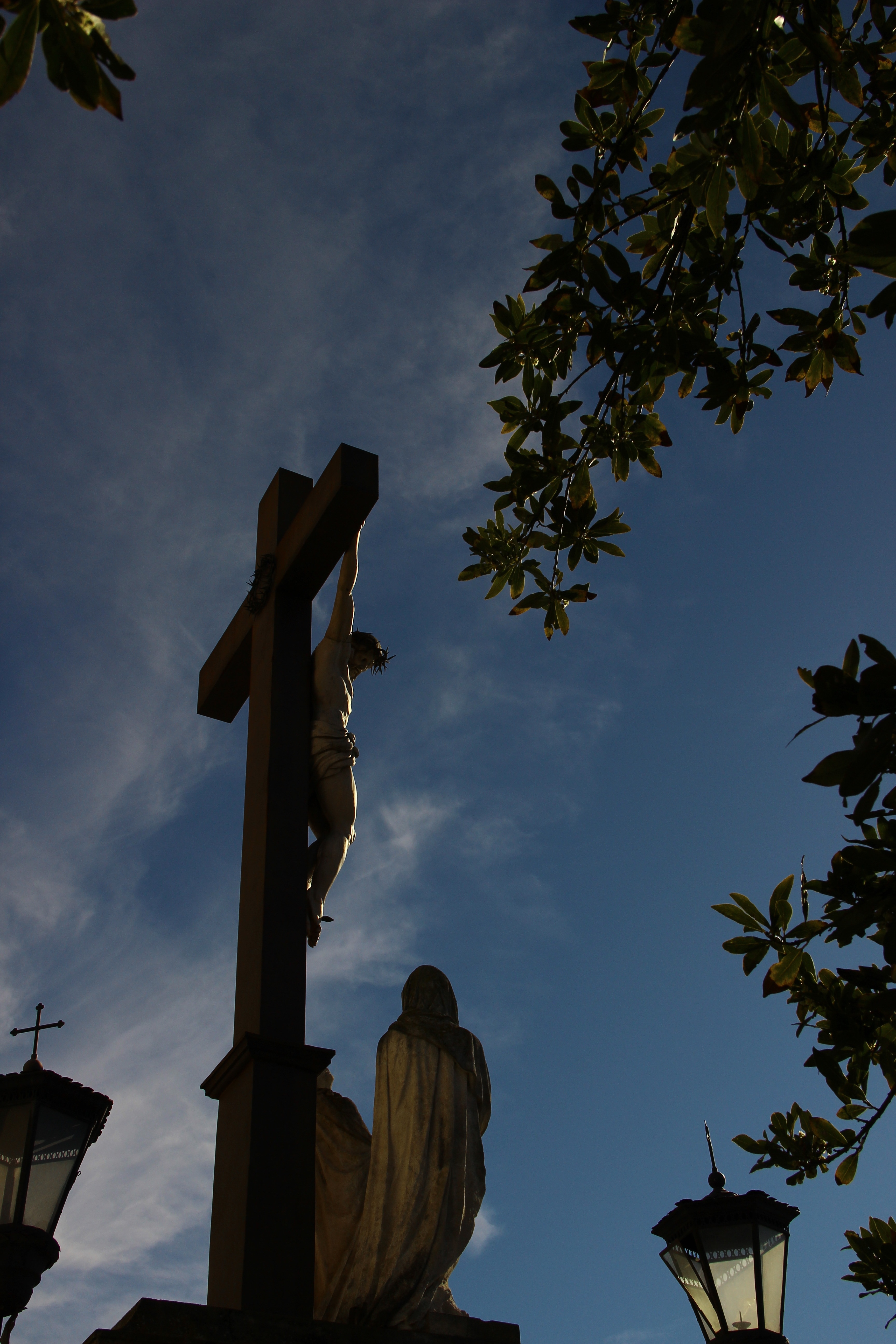crucifix and mama mary statue