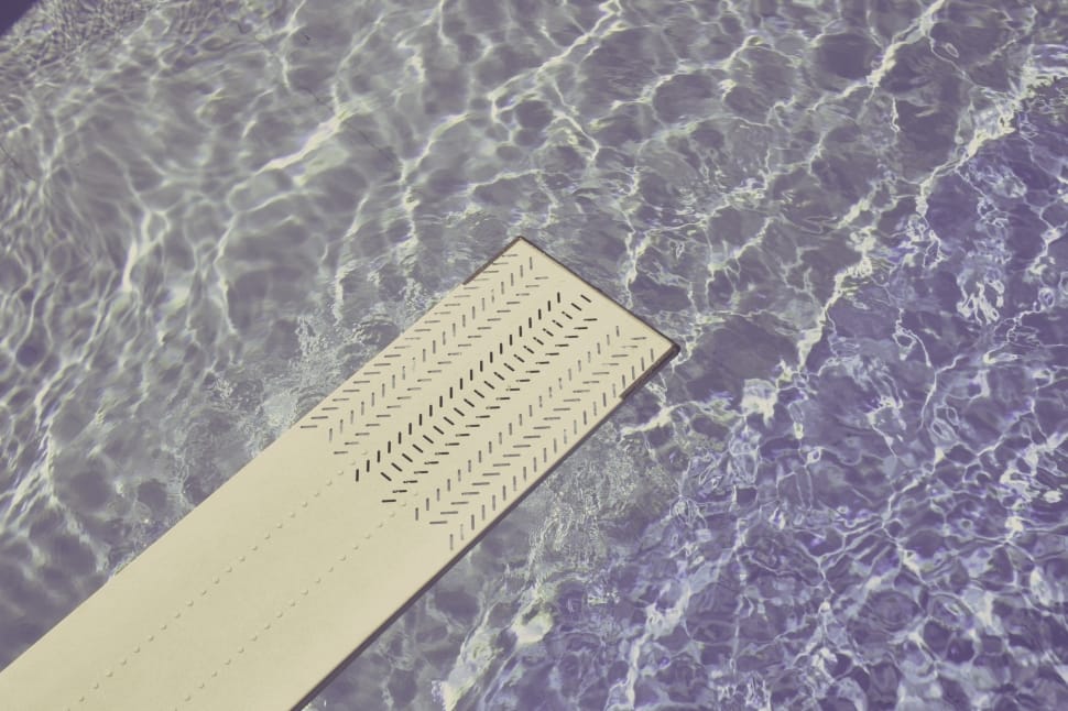 white diving board above water closeup photo preview