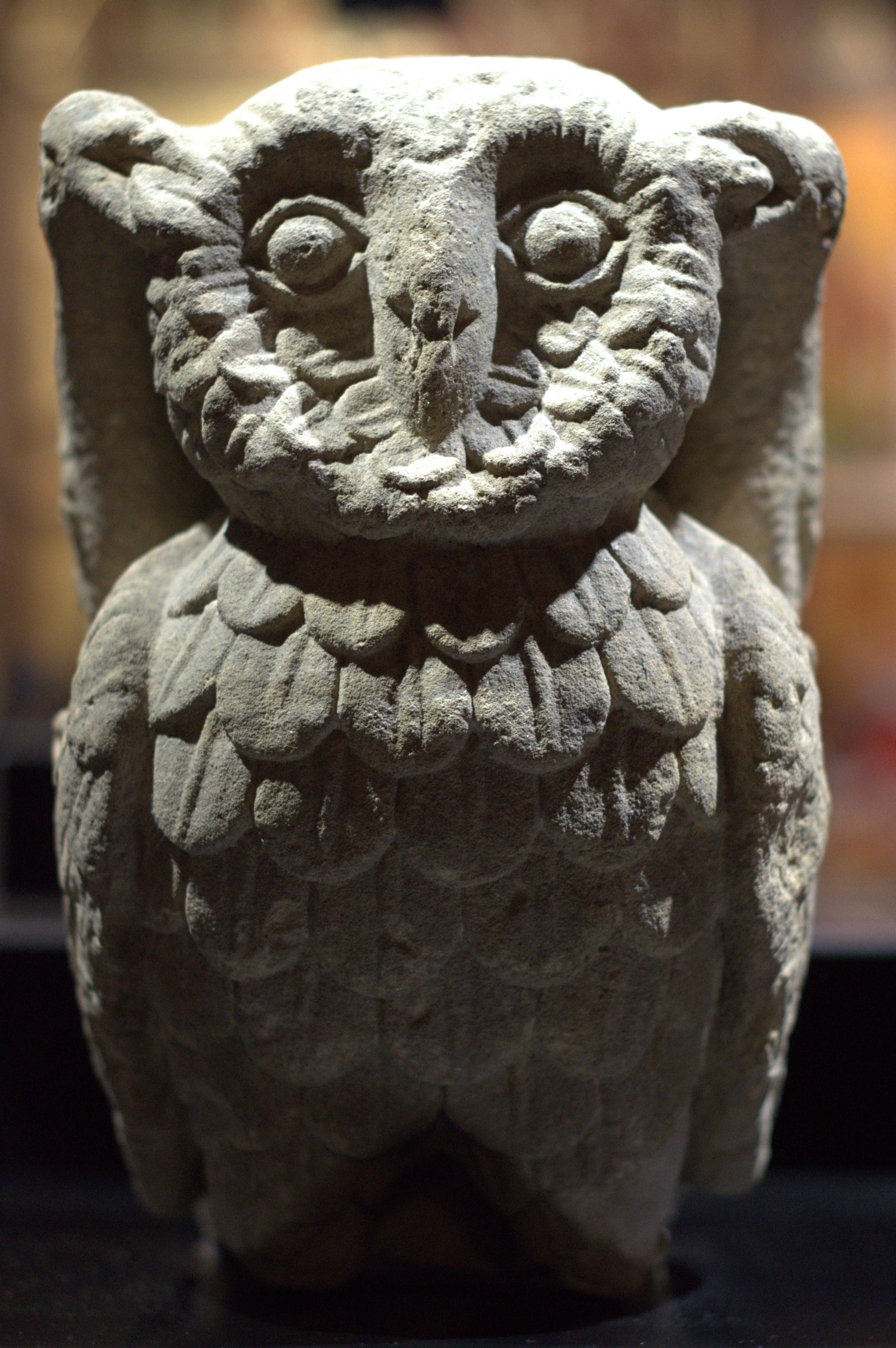 gray concrete owl figurine