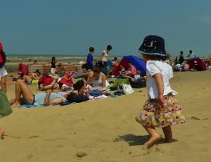 two toddler waling on brown sand at daytime thumbnail