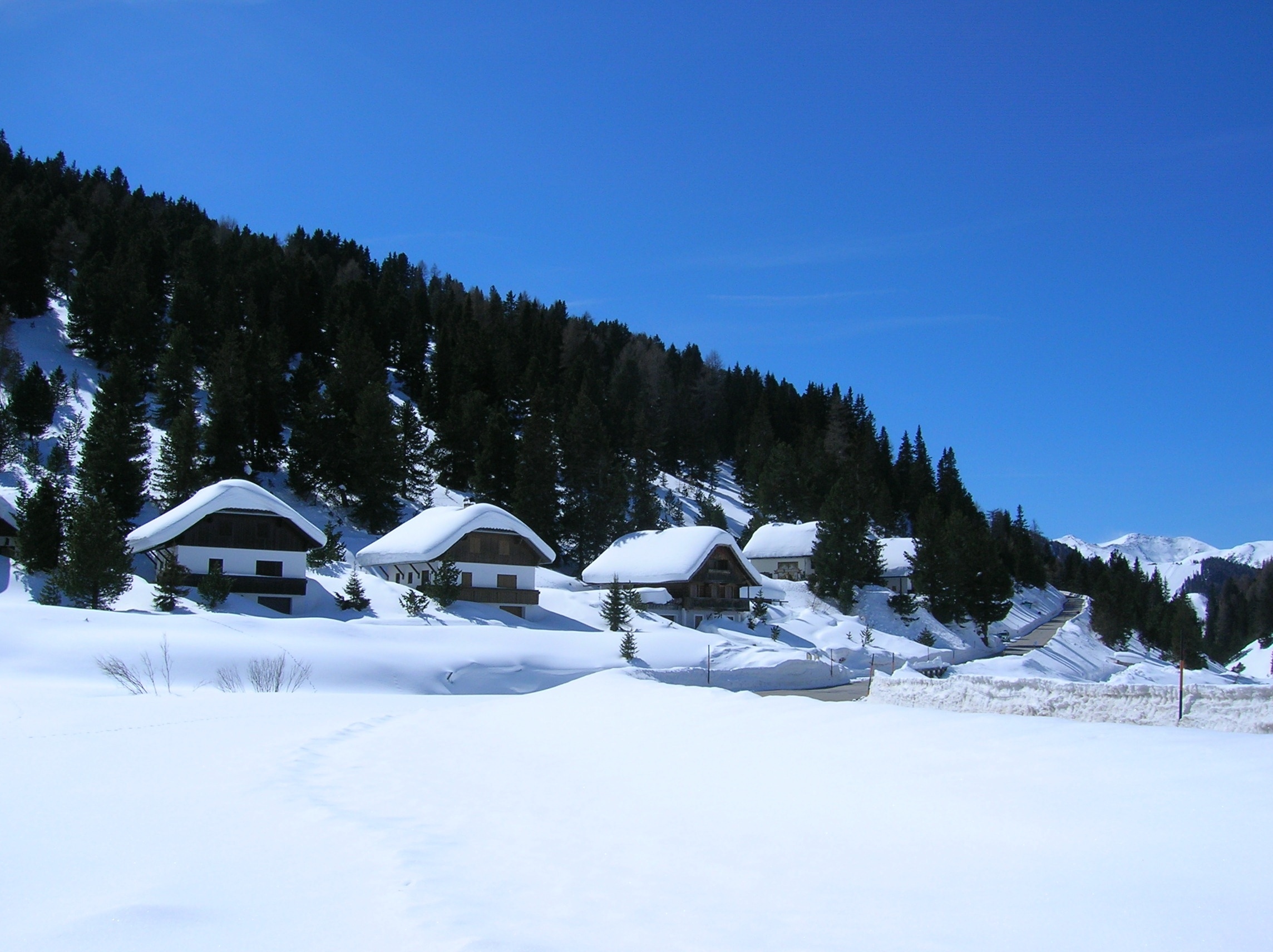 snow covered village houses and field