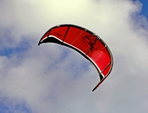 red-and-black paragliding thumbnail