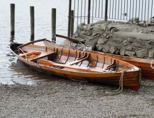 brown wooden row boat thumbnail