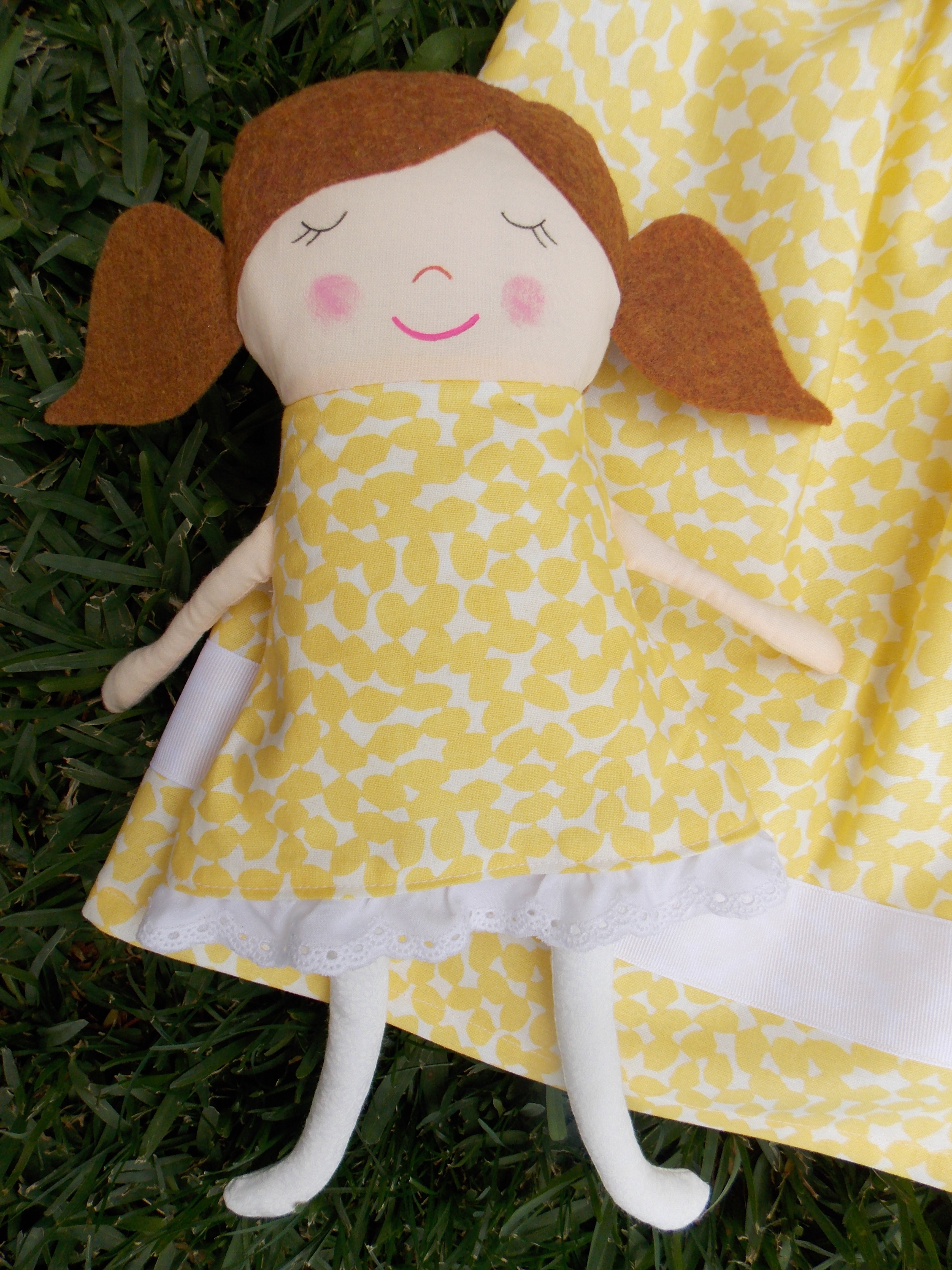 girl in yellow and white sleeveless dress plush toy