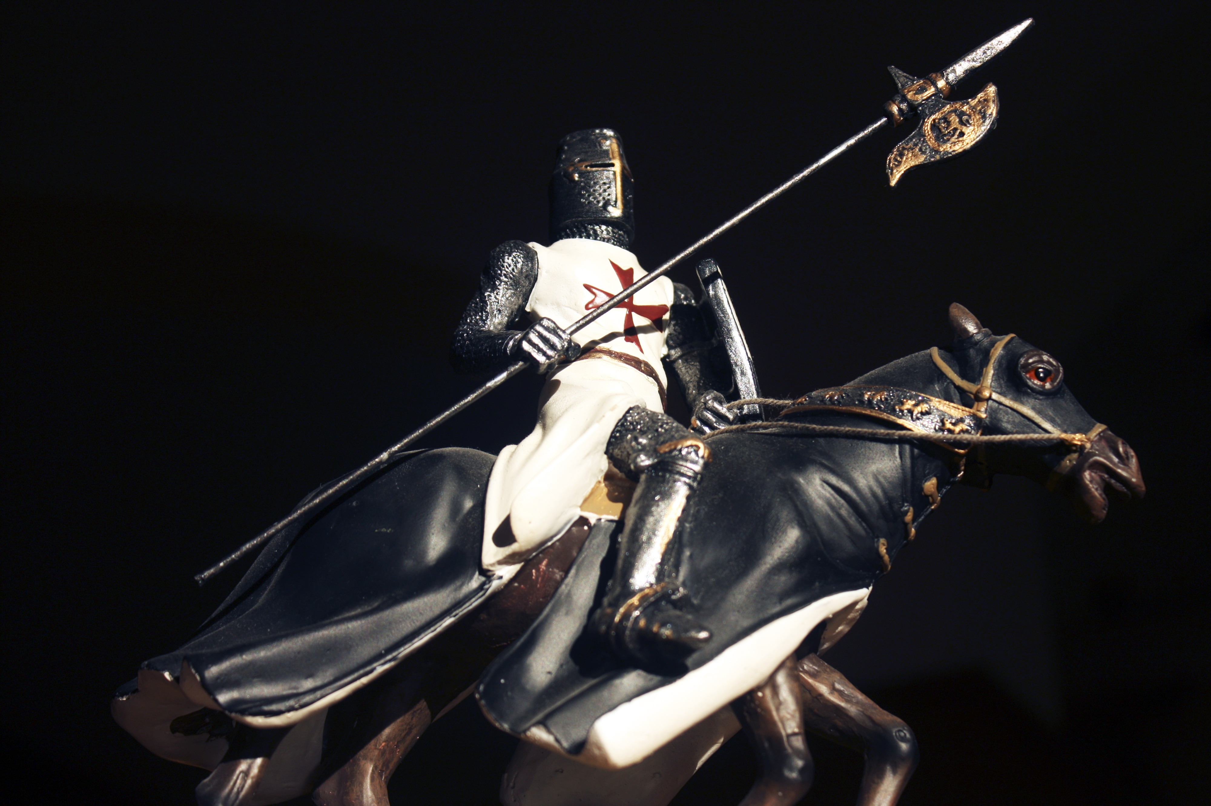 man riding black horse statue