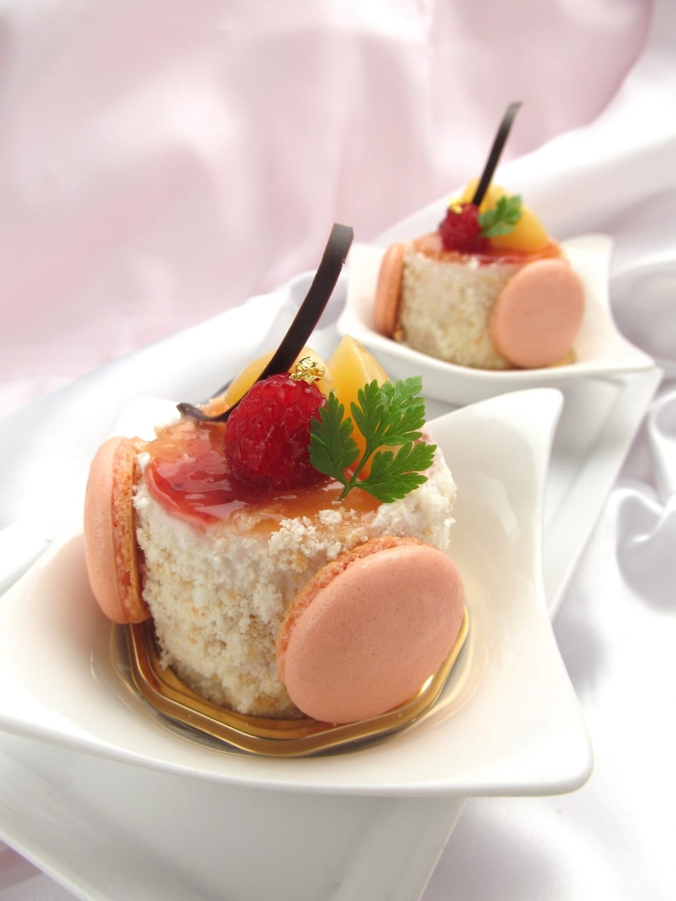 pink macaroons with strawberry and leaf dish preview