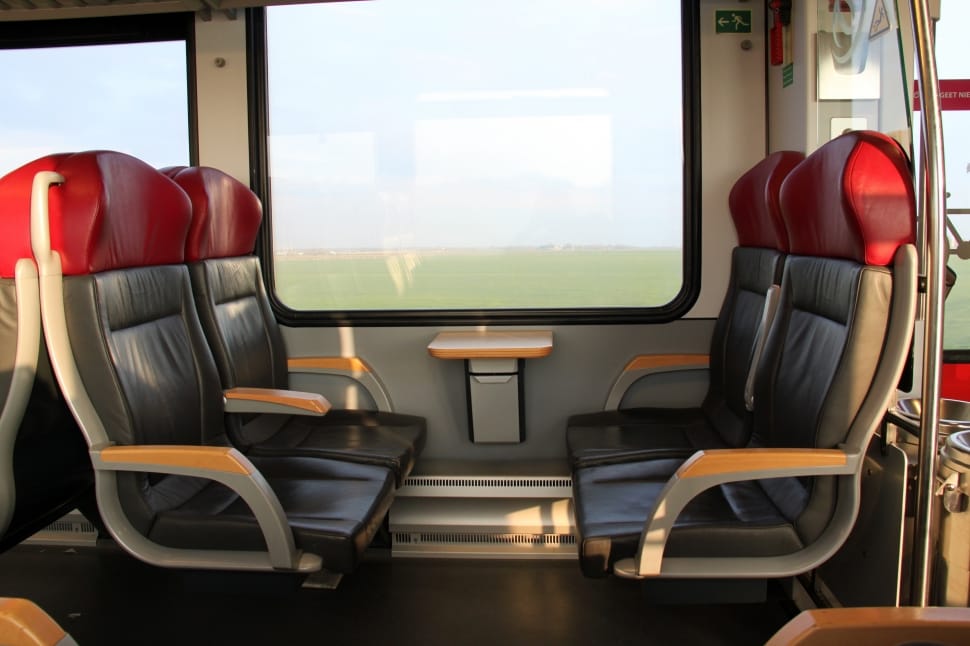 grey metal framed black leather train seats preview