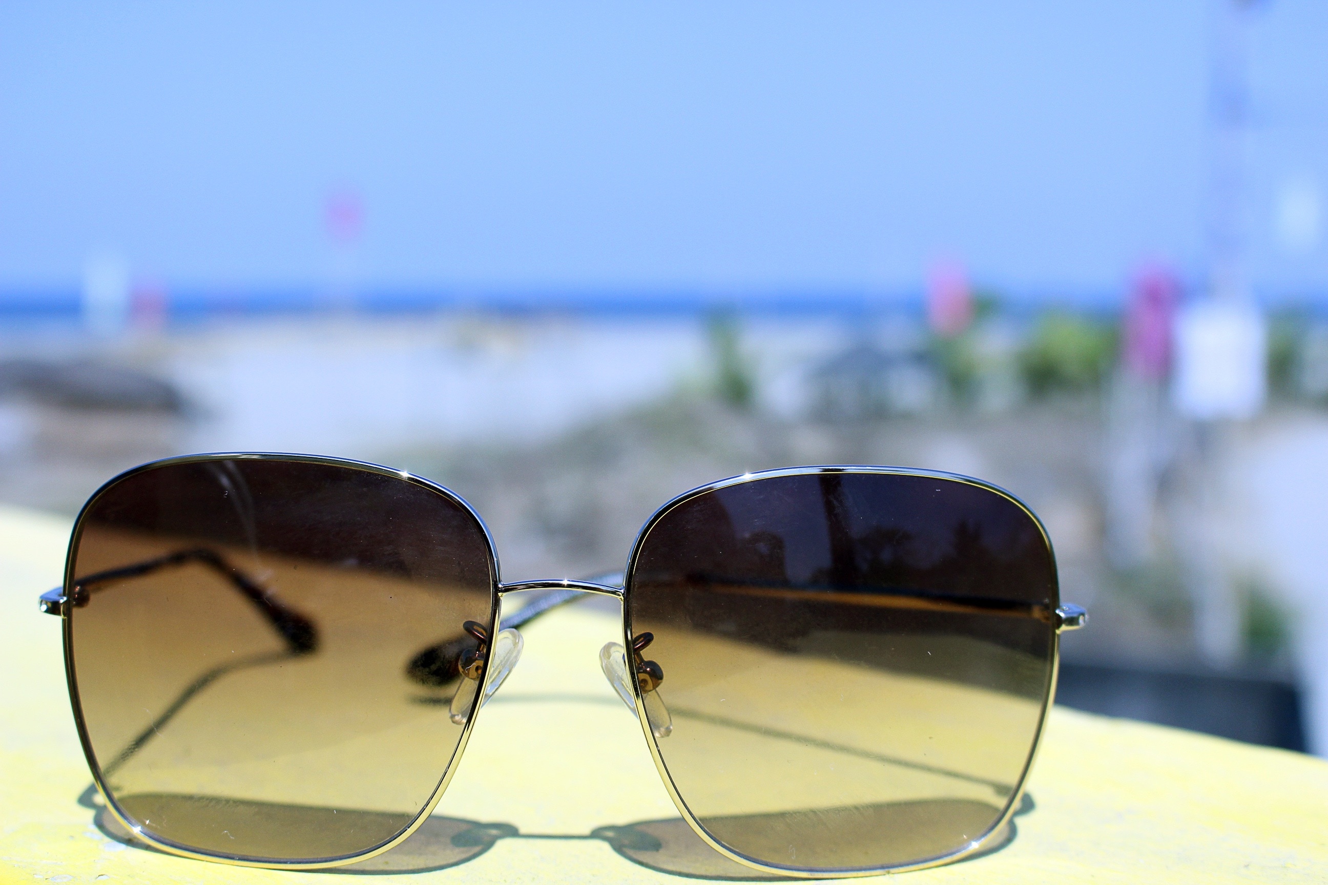 silver framed yellow lens sunglasses