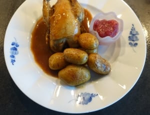 white ceramic plate with sauteed chicken and potatoes thumbnail