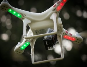 white and red quadcopter drone camera thumbnail