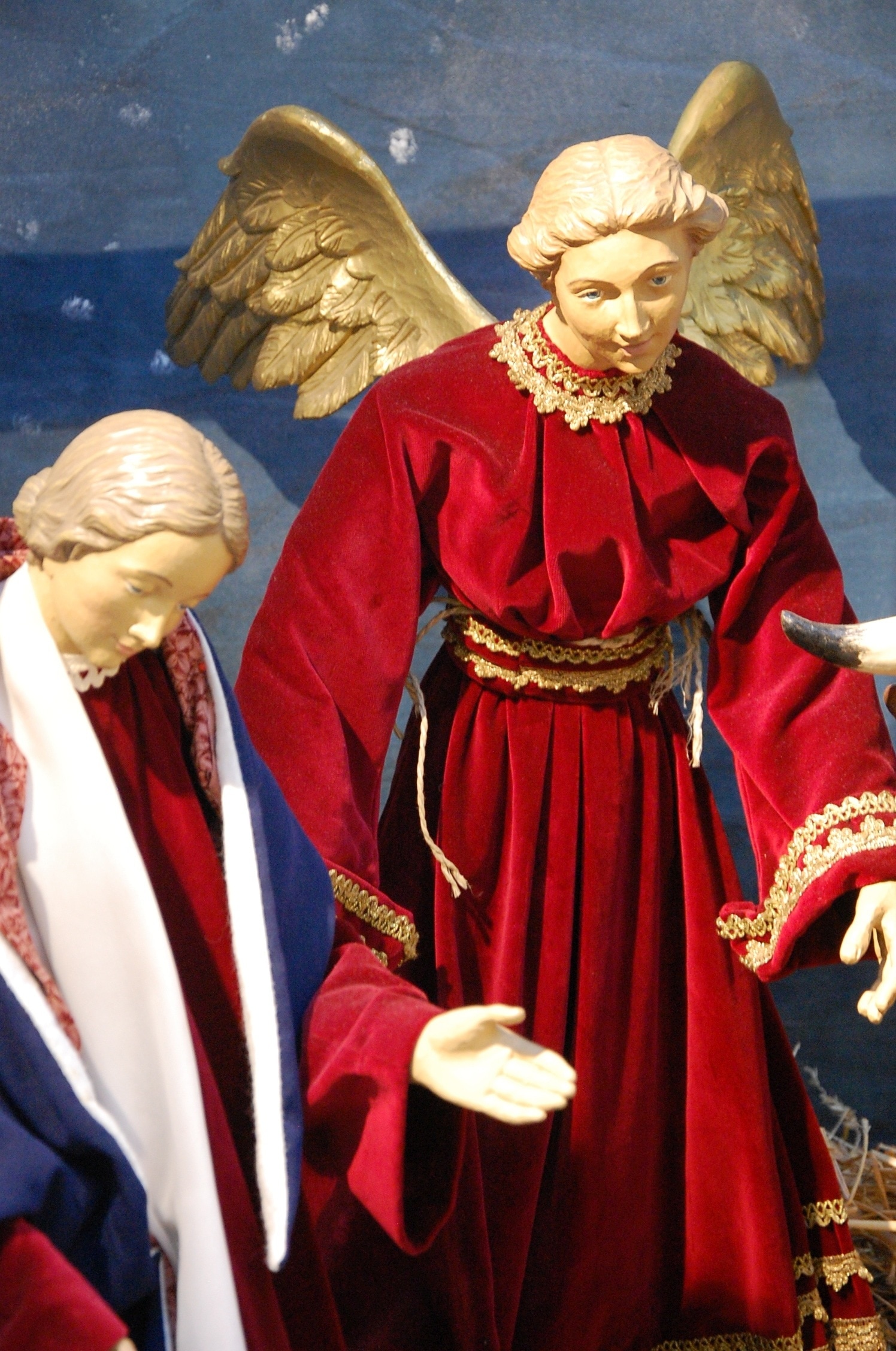 male angel i red dress figurine