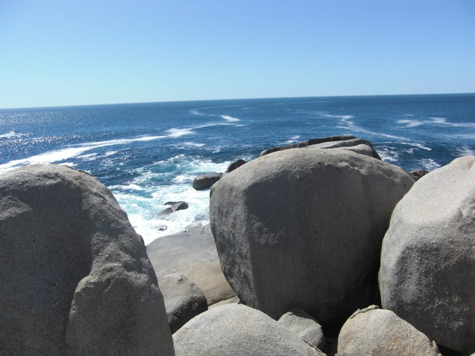 rocks near blue ocean preview