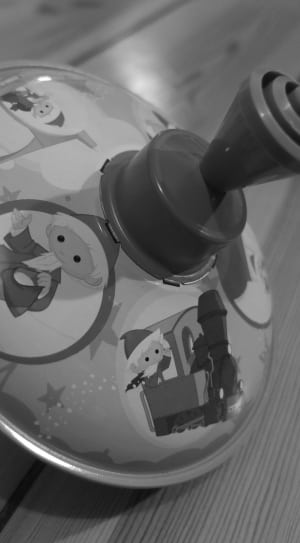 grayscale photo of activity toy thumbnail
