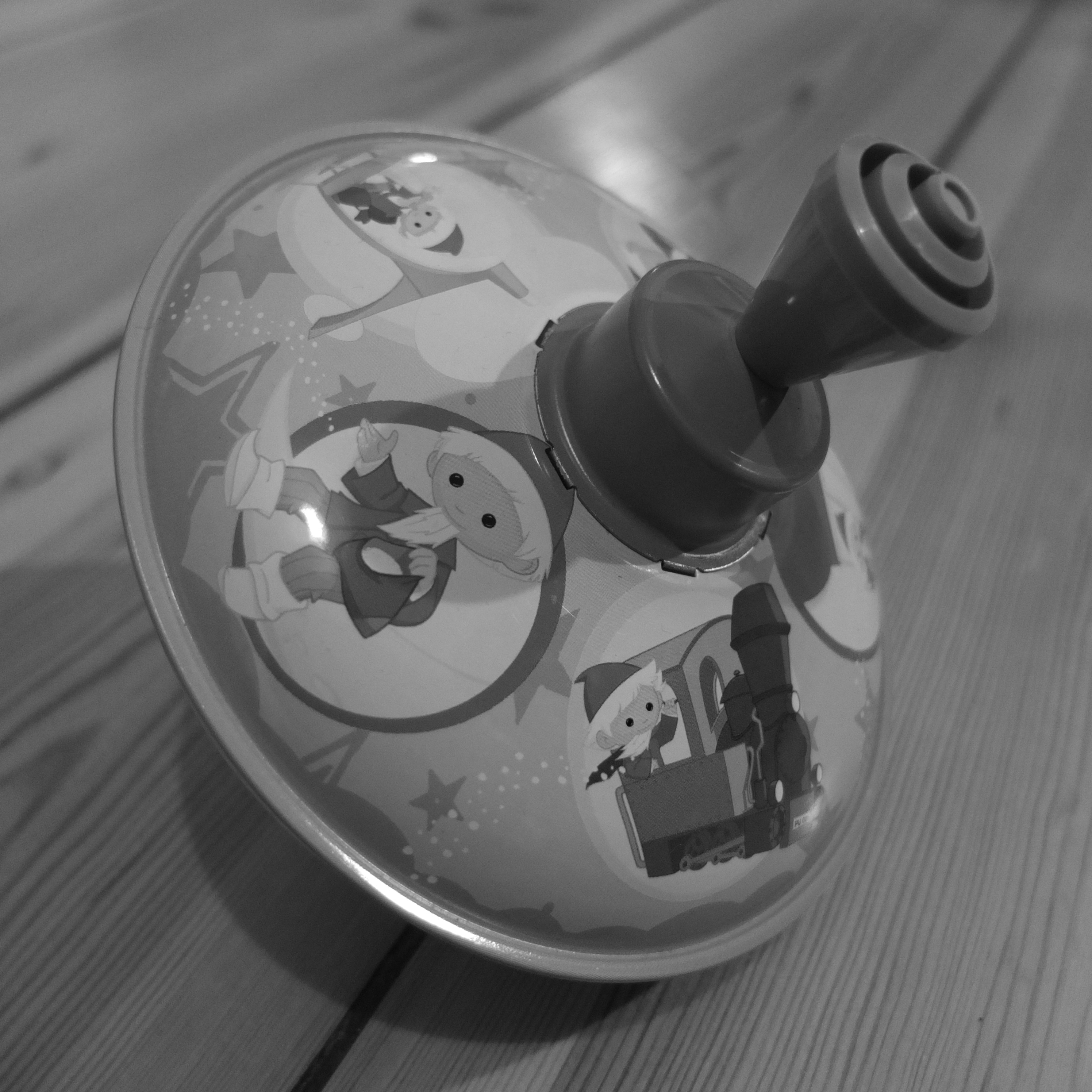 grayscale photo of activity toy