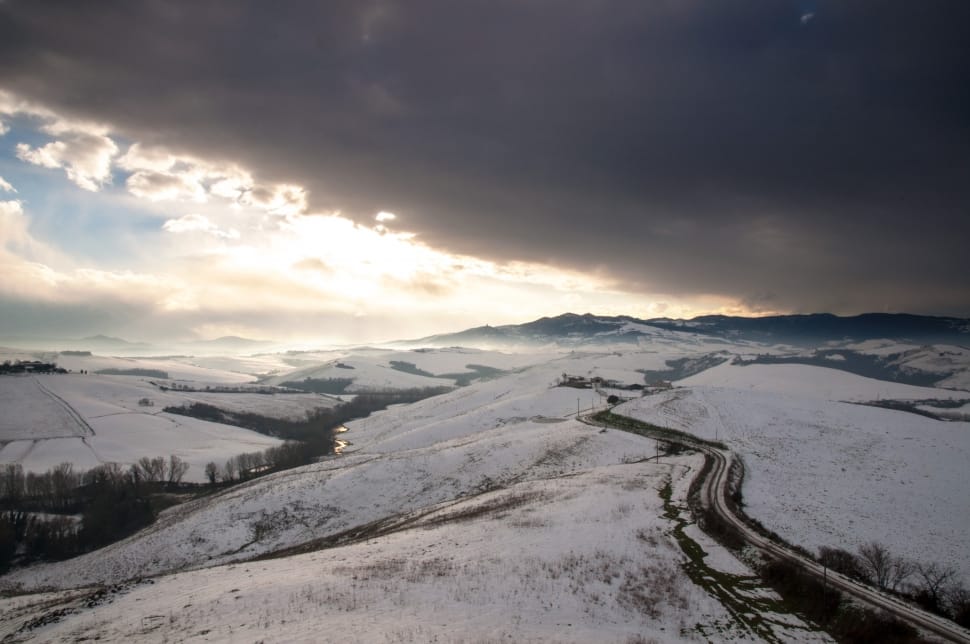 snow covered hills and highway preview