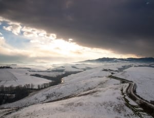 snow covered hills and highway thumbnail