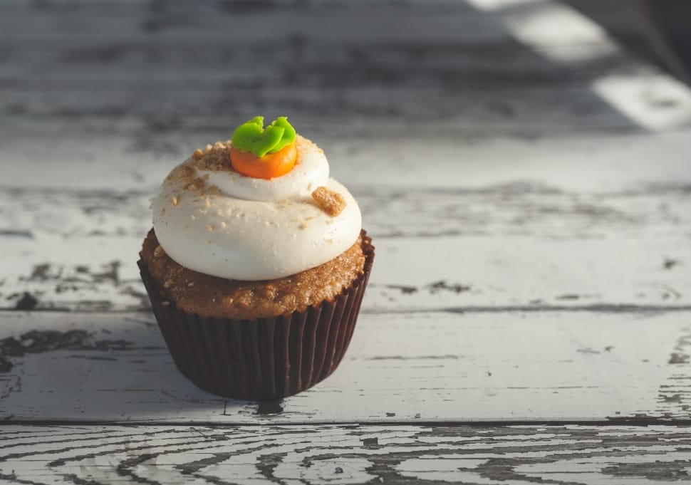 brown cupcake with white frosting preview