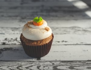 brown cupcake with white frosting thumbnail