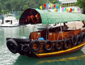 brown wooden passenger boat thumbnail