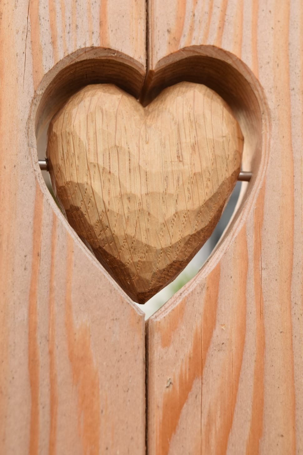 brown wooden heart carving preview