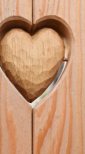 brown wooden heart carving thumbnail