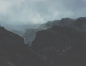 black and grey mountain during cloudy day thumbnail