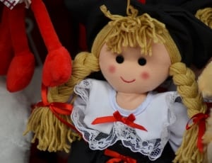 doll in white and red dress thumbnail