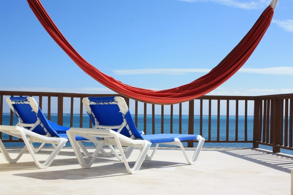 red hammock and two blue loungers preview