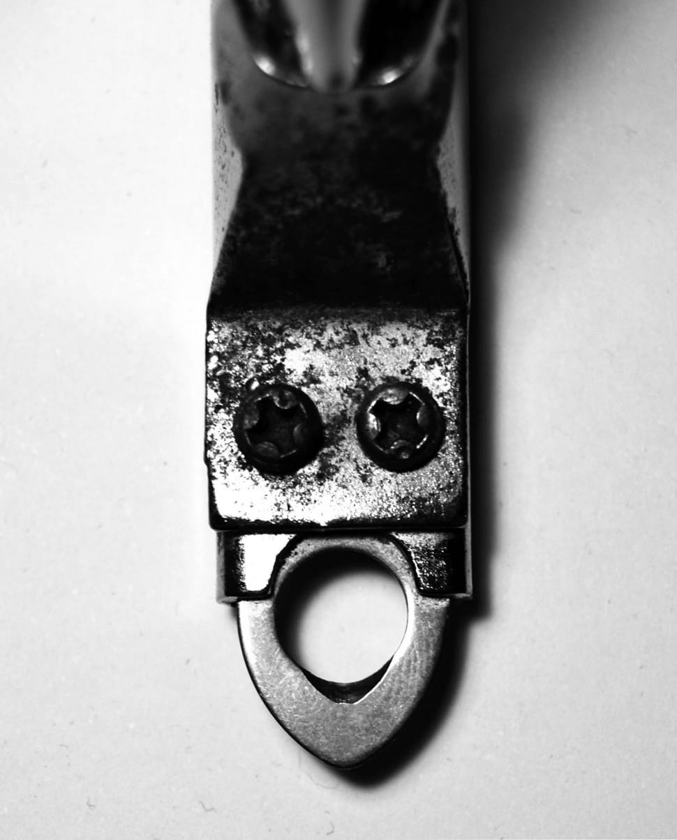 grayscale photography of gray bottle opener preview