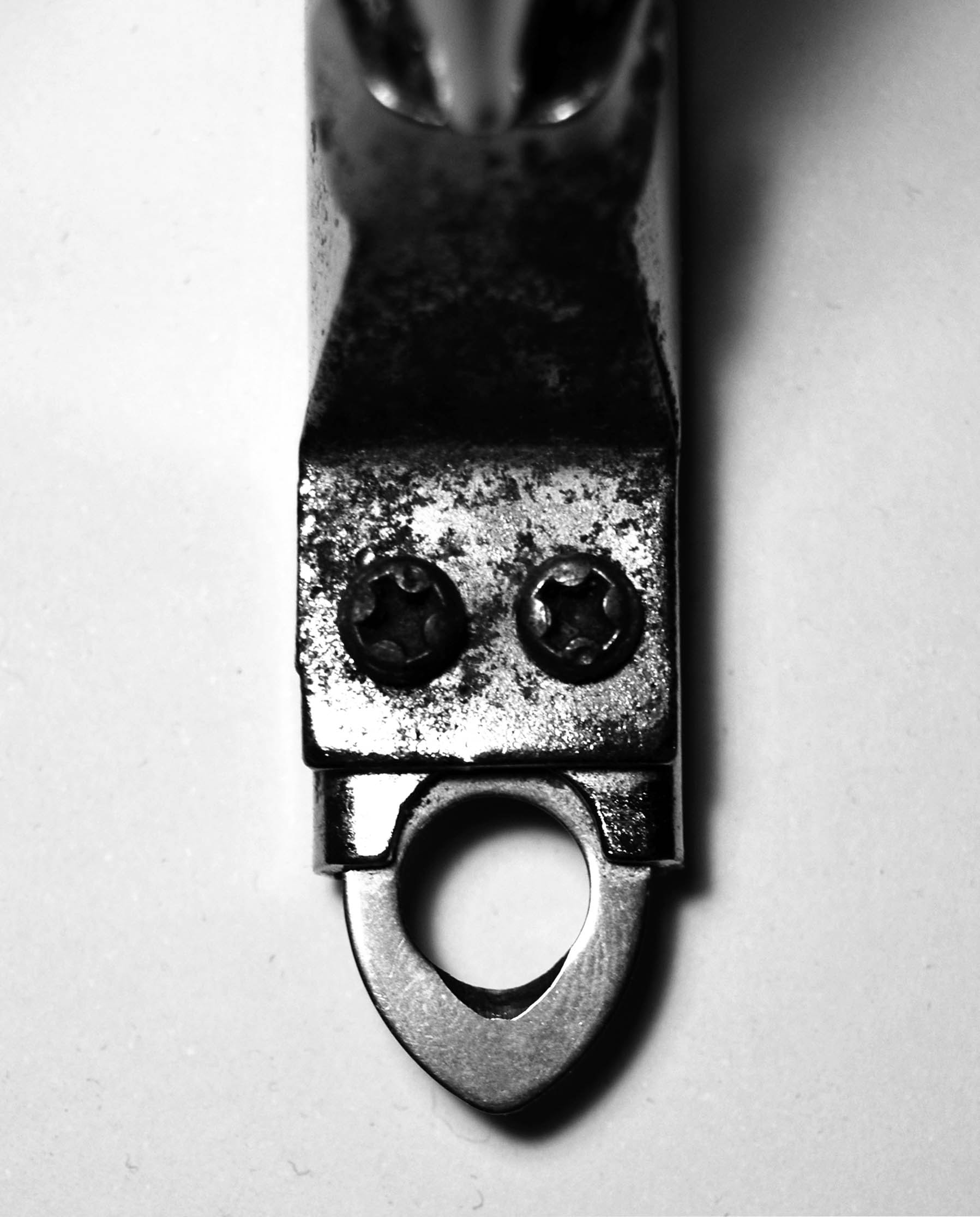 grayscale photography of gray bottle opener