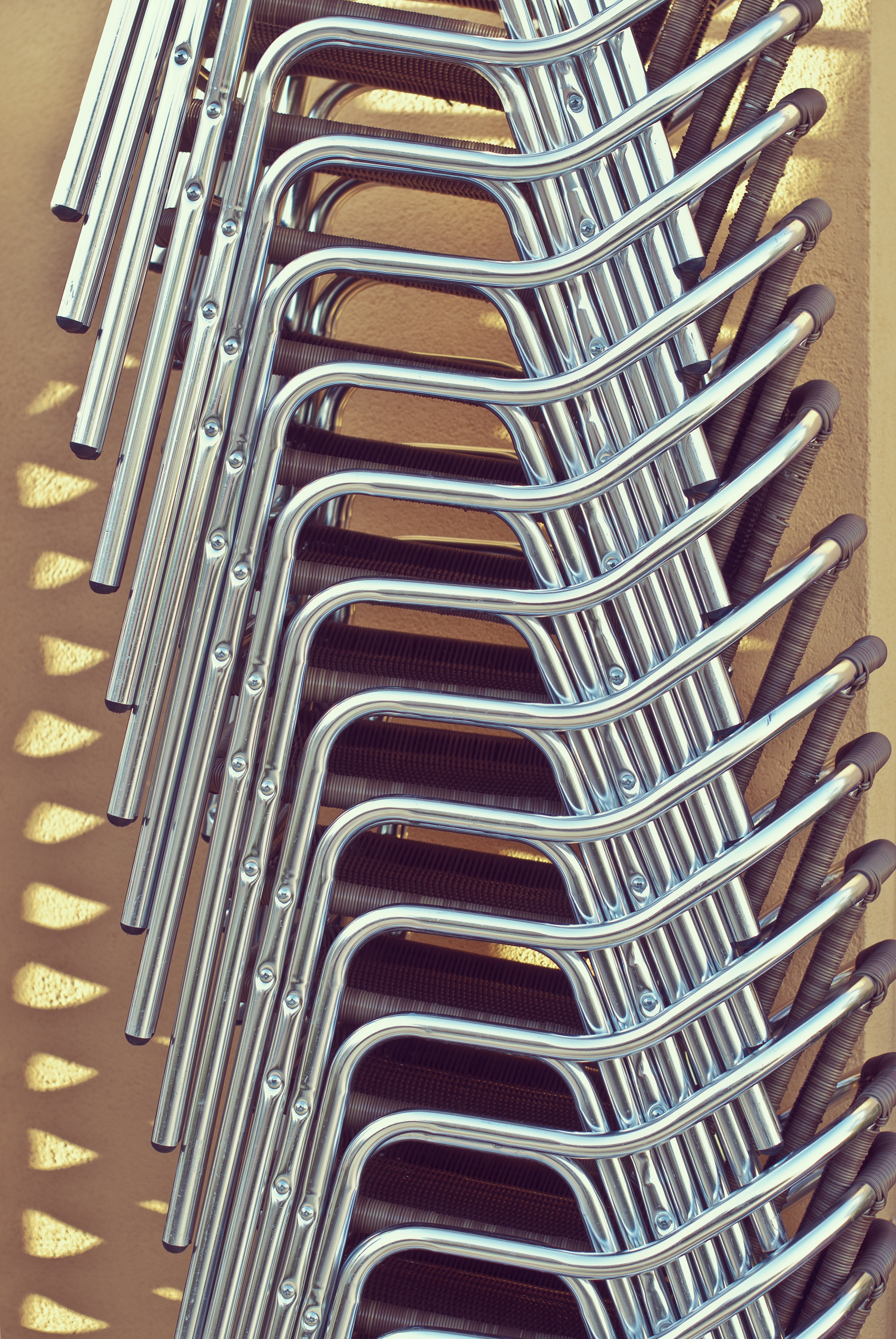 chrome and brown piled chairs