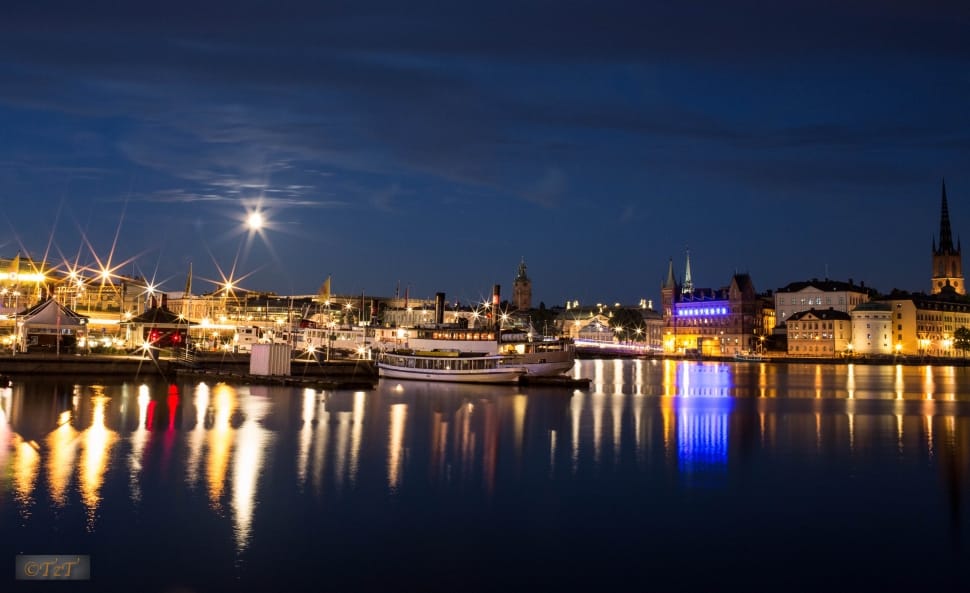 city buildings near ocean water during night time free image | Peakpx