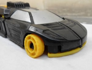black and yellow plastic toy car thumbnail