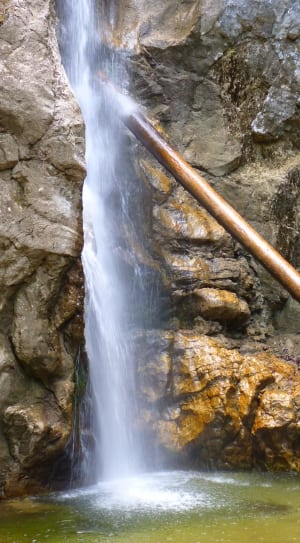 wooden post on waterfalls thumbnail