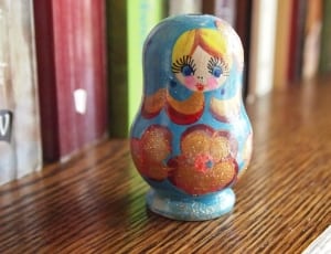 blue and orange floral russian nesting doll thumbnail