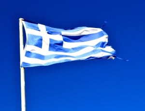 waving blue and white flag under blue sky during daytime thumbnail