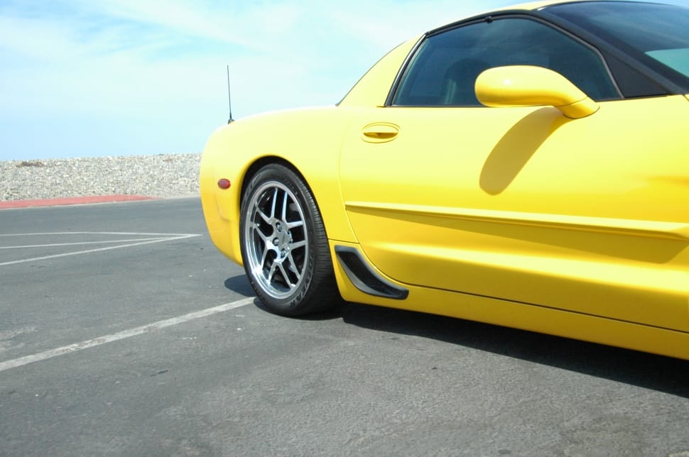 yellow sports coupe preview